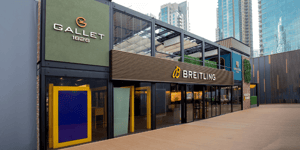 A side view of the Breitling exhibition stand at Dubai Watch Week, featuring a two-storey structure.