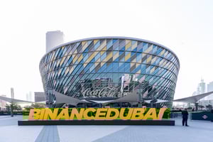 Exterior view of a modern building with prominent Binance Dubai signage