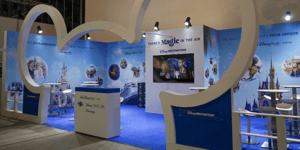 The Disney Destinations stand at ITB, featuring a large entrance shaped like Mickey Mouse’s ears and clips from Disney films displayed on the stand’s walls.