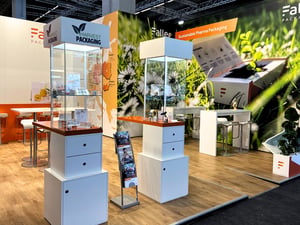Faller Packaging booth at CPHI Frankfurt 2025 with printed walls and glass displays.