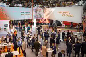 Visitors inside the open STILL exhibition booth at LogiMAT 2026, surrounded by brand messaging and communication areas.