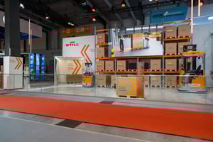 Wide-angle view of the two-story STILL exhibition stand with LED elements and structured thematic zones at LogiMAT 2026.