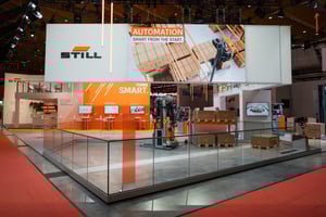 Presentation area for STILL automation and smart fleet solutions with demo zone and media displays.