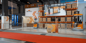 Wide-angle view of the two-story STILL exhibition stand with LED elements and structured thematic zones at LogiMAT 2026.