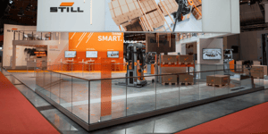 Presentation area for STILL automation and smart fleet solutions with demo zone and media displays.