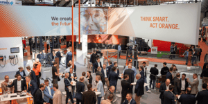Visitors inside the open STILL exhibition booth at LogiMAT 2026, surrounded by brand messaging and communication areas.