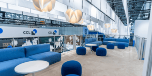 Second floor of Sappi's exhibition stand at Interpack 2026 with blue couches and paper decorations.
