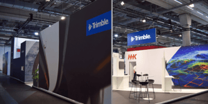 Side view of the Trimble booth showcasing branding and display zones for digital solutions in geodata and surveying.