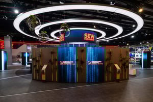 Futuristic exhibition stand for SEW EURODRIVE with spheric and circle elements as well as LED displays.