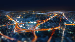 A stylised network of orange lines within a glass structure.