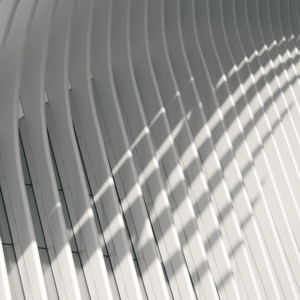 A white architectural structure with a framework-like façade.