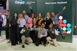 Cargill and ET GLOBAL team celebrating in front of the “Next Level. Realized.” branding wall at the IPPE 2026 booth.