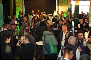 Guests at the Cargill Terminus 330 Event during IPPE 2026 in a vibrant, green‑lit branded environment.