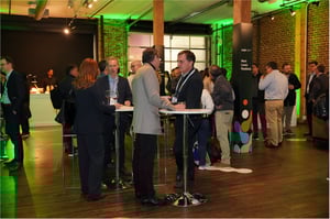 Guests networking at the Cargill Terminus 330 Event surrounded by branded lighting and rebrand graphics.