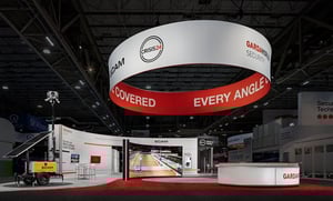 GardaWorld exhibition booth with a giant red ring