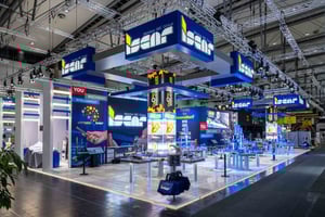 IMC Group booth showcasing Iscar branding with striking blue design and multiple product displays for machining technology.