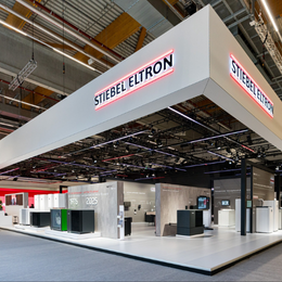 Stiebel Eltron’s C8 exhibition stand at ISH 2025, featuring a large roof structure and a modern design.